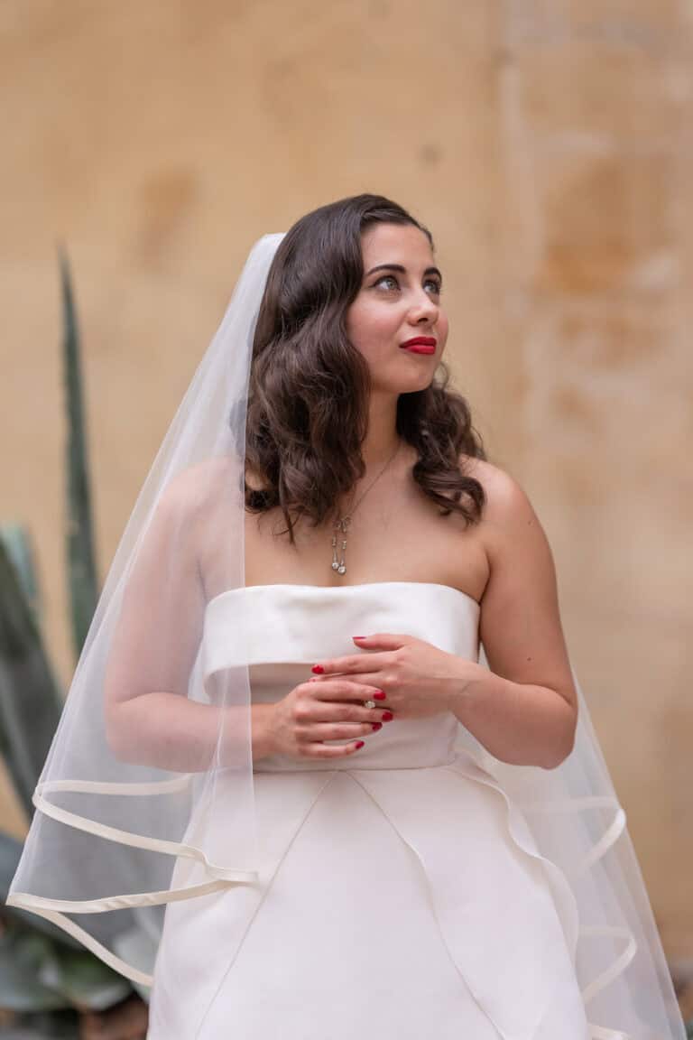 Bride in elegant white dress and veil