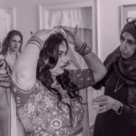 Women preparing for a traditional ceremony.