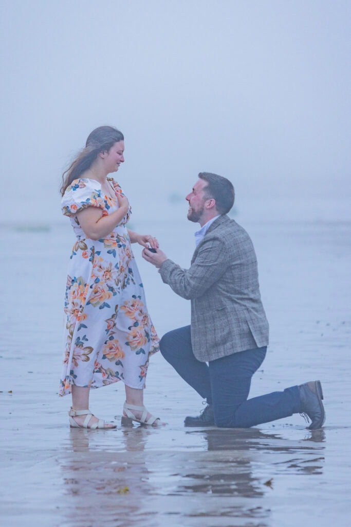 Marriage proposal on a foggy beach