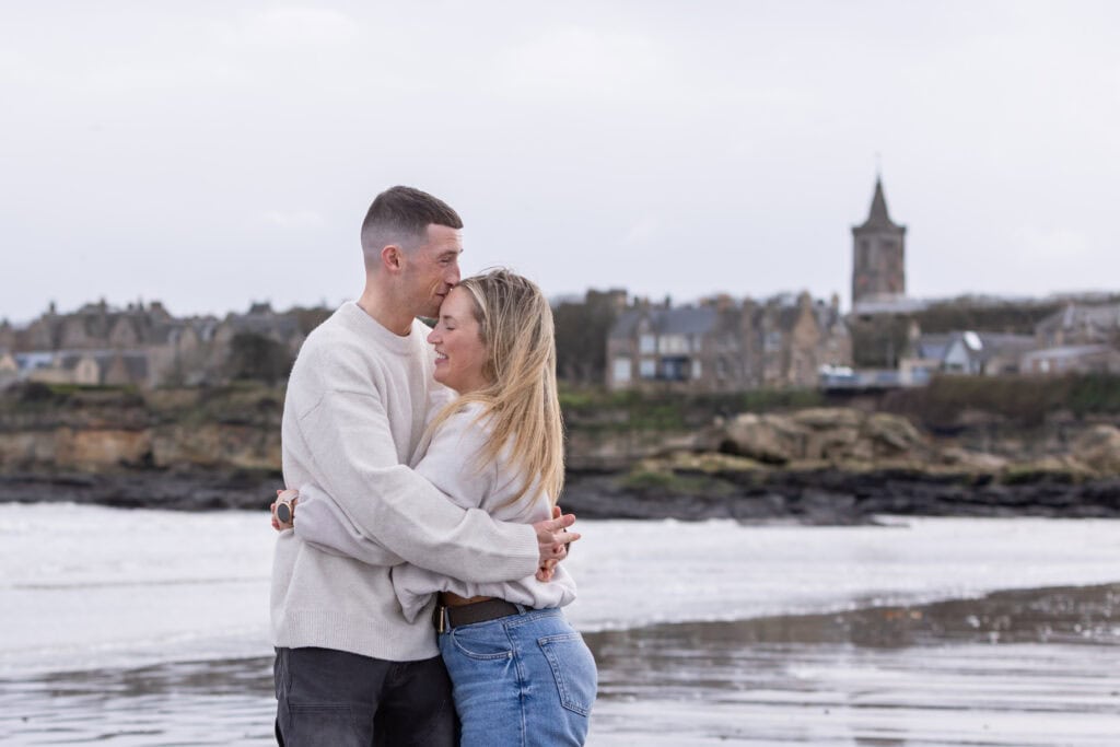 Couple embracing at scenic seaside
